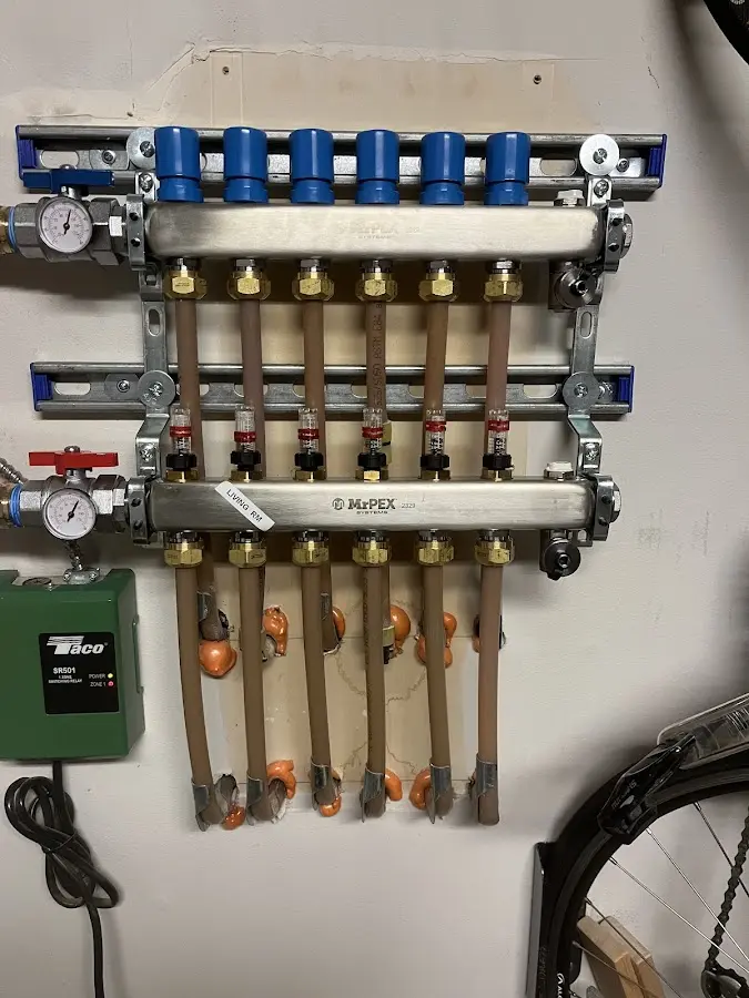 Plumber performing Water Heater Repair at a residential property in Conroe